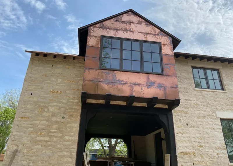 Copper metal panel facade on a stone building for Skylight Installation in Kentfield