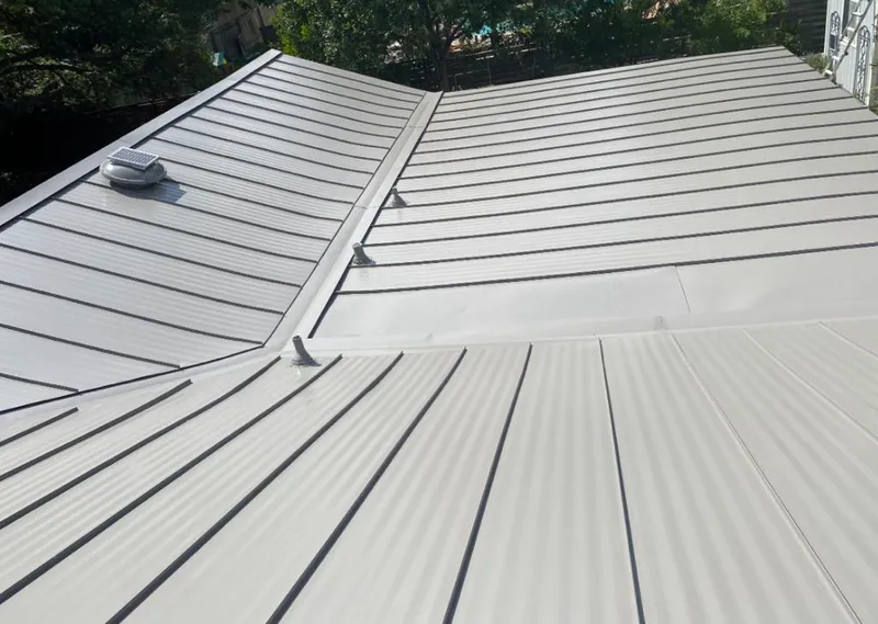 Solar attic fan installed on a metal roof for Roof Ventilation in Kentfield